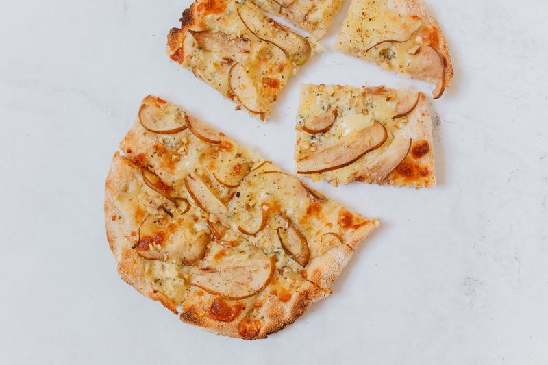Spicy Italian thin crust pizza with salami and chili